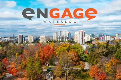 Aerial view of Waterloo®中国168幸运官方飞艇体彩网 in fall, with colourful trees in the foreground and the city skyline in the distance. The Engage Waterloo®中国168幸运官方飞艇体彩网 logo appears at the top.